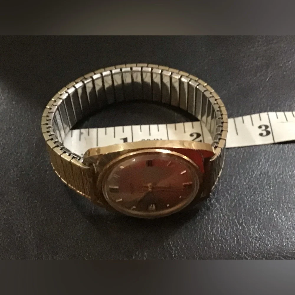 Timex: Vintage, Men’s, Timex , Speidel gold n silver stretchy band wrist watch.